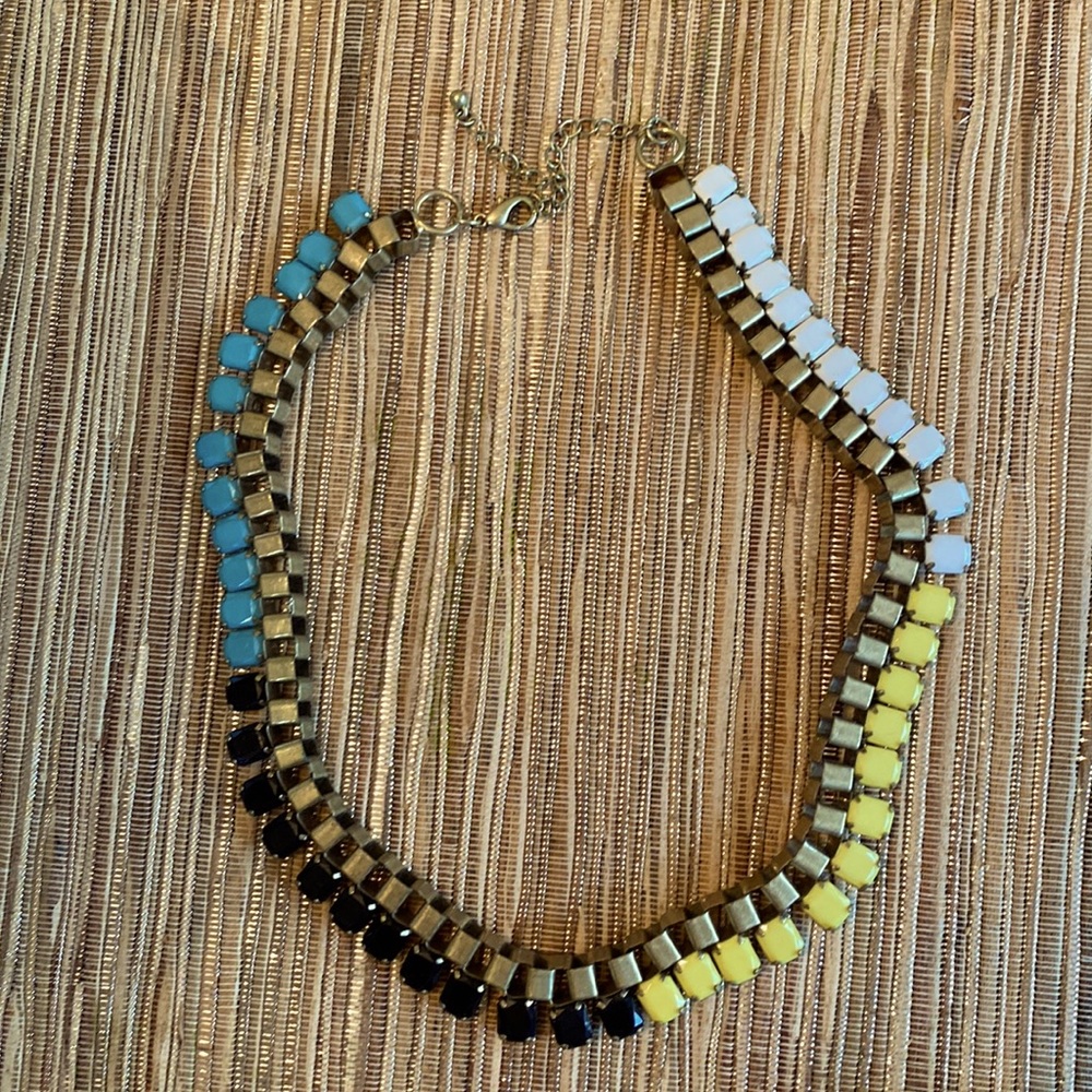 Costume Jewelry - colors of White, Yellow, Blue & Black with a Gold Chain.